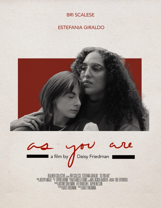 On a beige background, a black and white of two women, sitting with arms around each other, one looking into the distance, the other with eyes closed, both with a concerned expression. In red text appear the words, Bri Scalese, Estefania Giraldo, As You Are. In black, a film by Daisy Friedman and film credits in very small text.